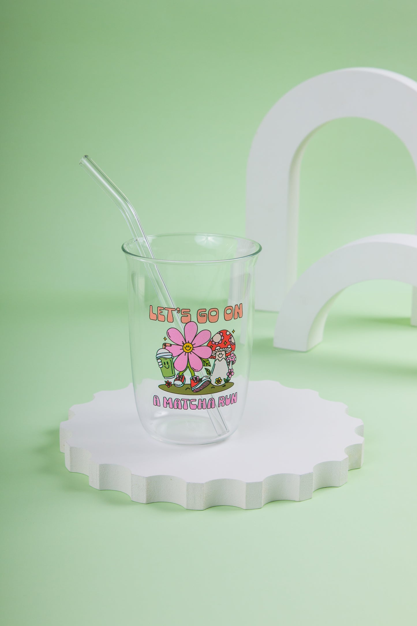 Glass cup with straw